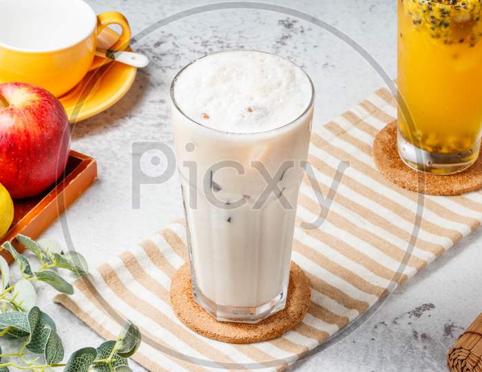 Iced Immortal Grass Iced Milk Tea On Mat And White Background. Fresh Healthy Drinks Concept