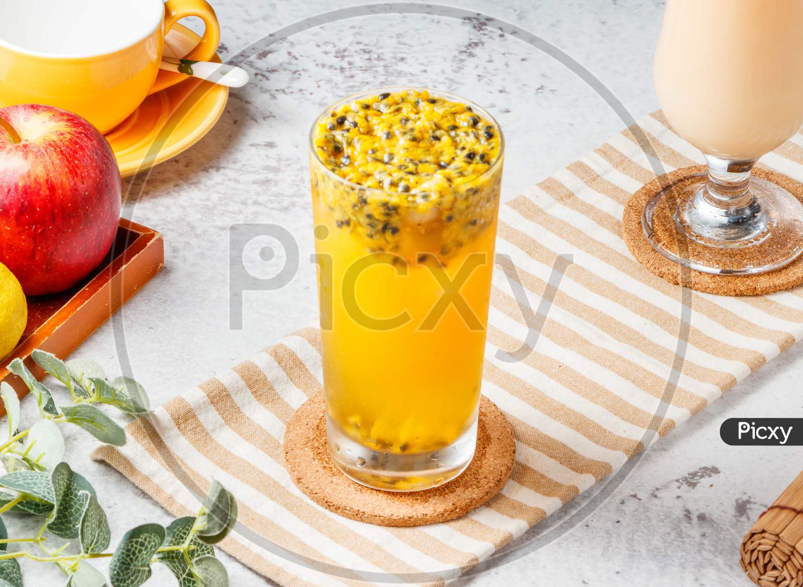 Iced Passion Fruit Green Tea Isolated On Mat And White Background. Healthy Drinks Concept