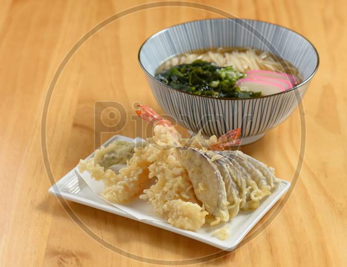 Japanese Cuisine Tempura Udon Noodle With Vegetable In Dish And Bowl Isolated On Wooden Background Top View