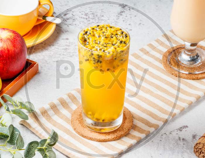 Iced Passion Fruit Green Tea Isolated On Mat And White Background. Healthy Drinks Concept