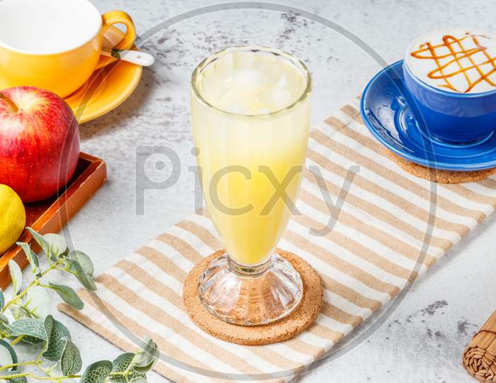 Iced Kumquat Lemon Tea In A Glass On Mat With Grey Background Breakfast Drink
