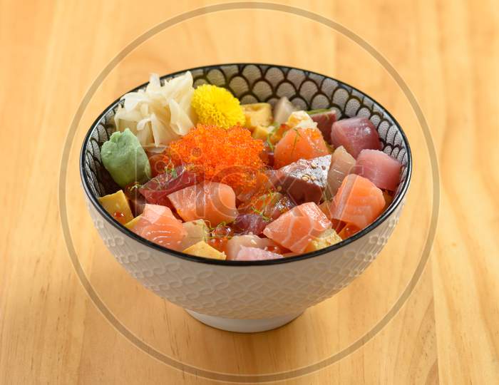 Japanese Cuisine Ultimate Bara Chirashi With Rice And Fish In Bowl Isolated On Wooden Background Top View