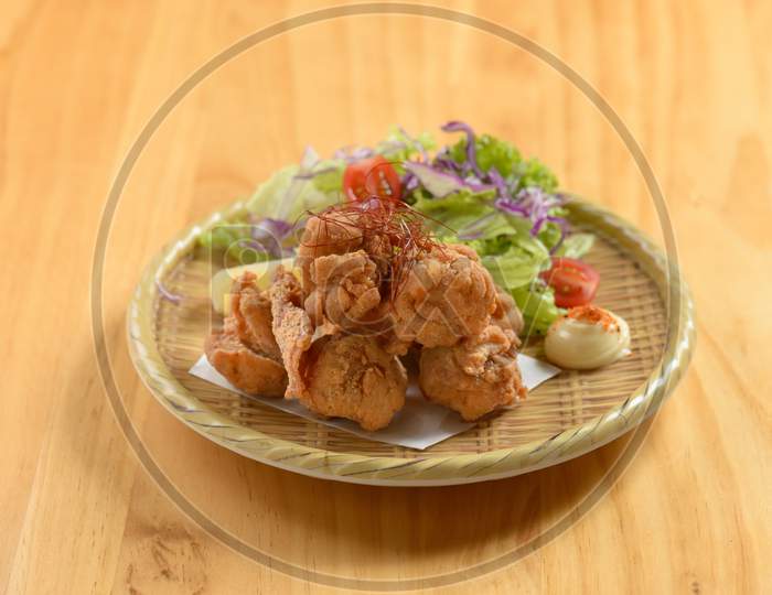 Japanese Food Deep Fried Chicken Tori Karaage In A Wooden Plate Isolated On Wooden Background Top View