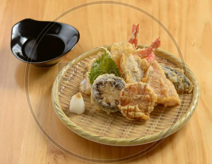 Japanese Food Tempura Moriawase In A Wooden Plate Isolated On Wooden Table Top View