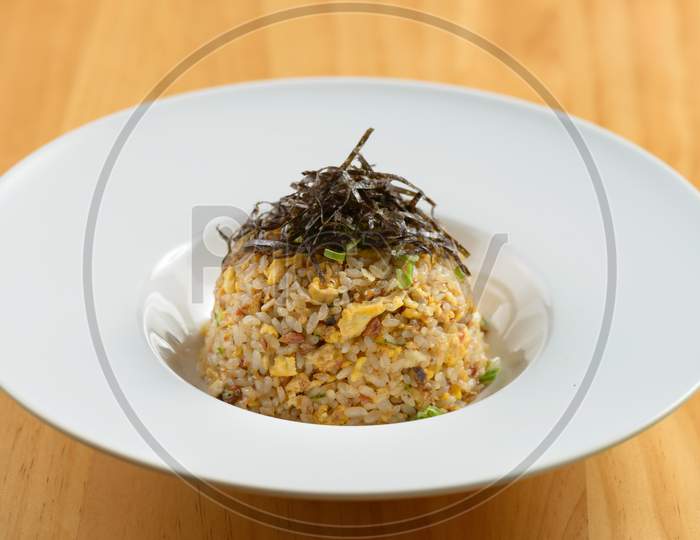 Garlic Chahan Fried Rice In White Bowl On White Plate Isolated On Wooden Background Top View Of Chinese Food