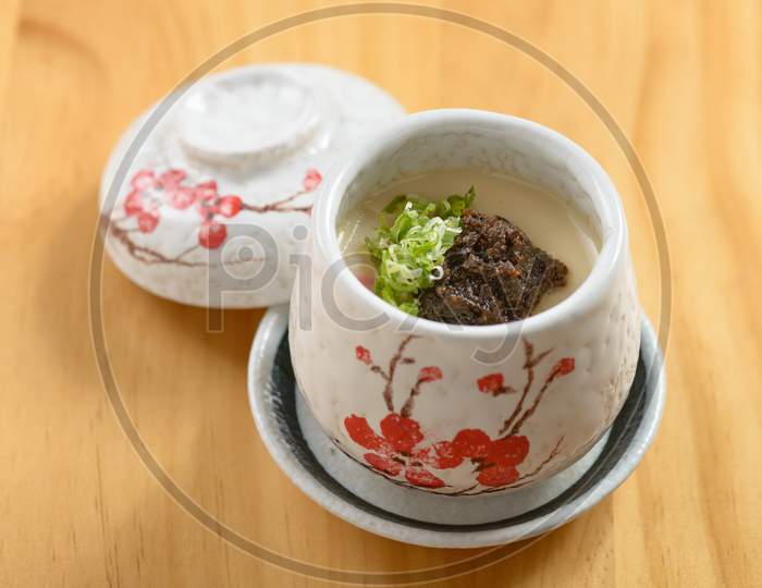 Japanese Food Truffle Chawanmushi Steamed Egg Served In A Bowl Isolated On Wooden Background Top View
