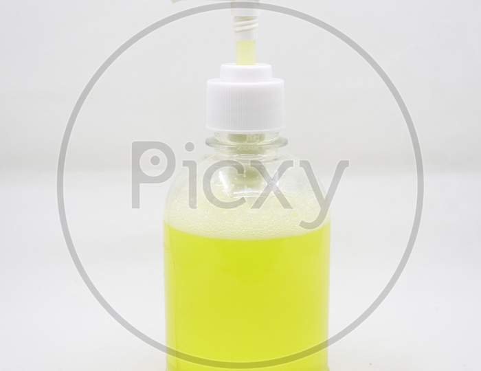 press type soap dispenser with yellow soap solution