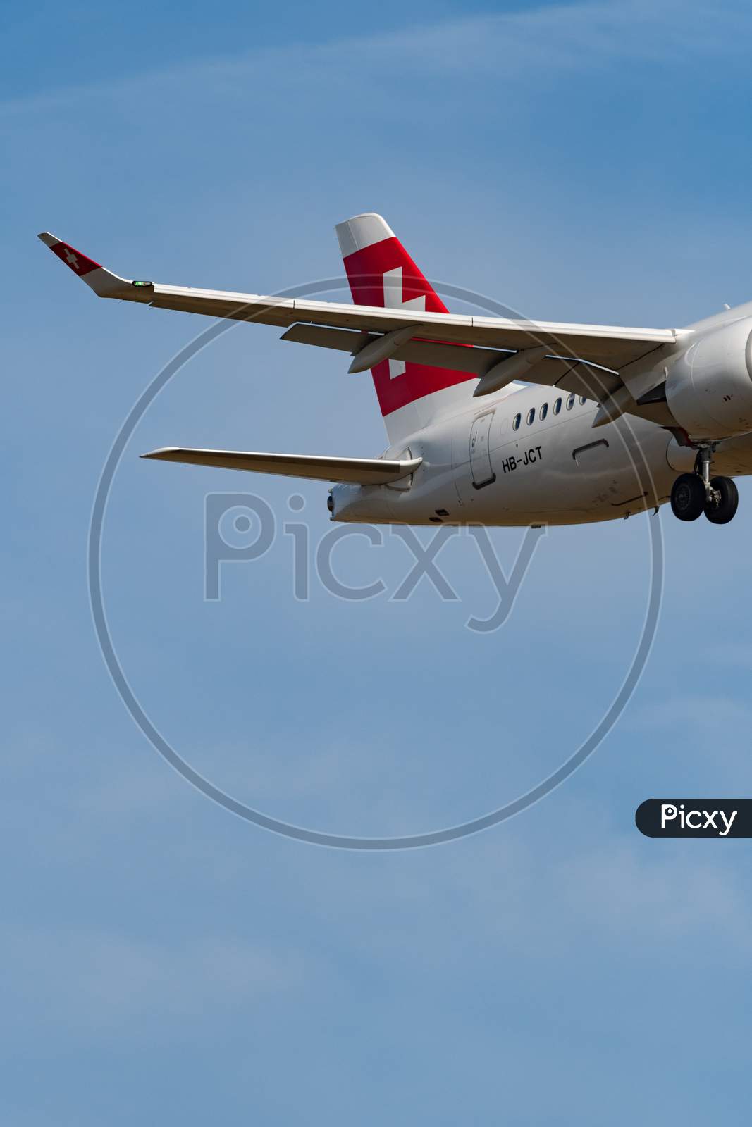 Swiss Bombardier Cs-300 Jet Final Approach In Zurich In Switzerland