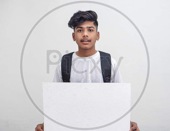 Indian College Student Showing Board On White Background.