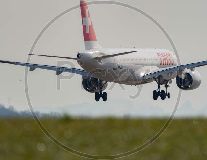 Swiss Bombardier Cs 300 Airplane Arrival In Zurich In Switzerland