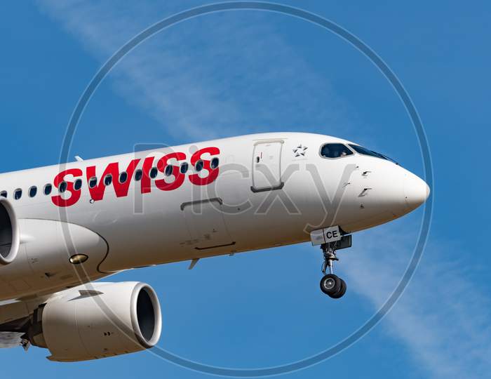 Swiss Bombardier Cs 300 Airplane Arrival In Zurich In Switzerland