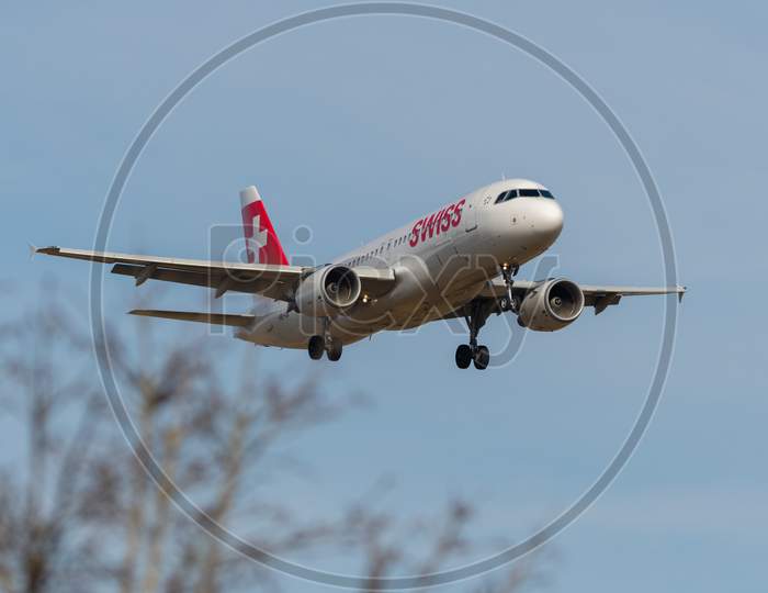 Swiss Airbus A320-214 Airplane Arrival In Zurich In Switzerland