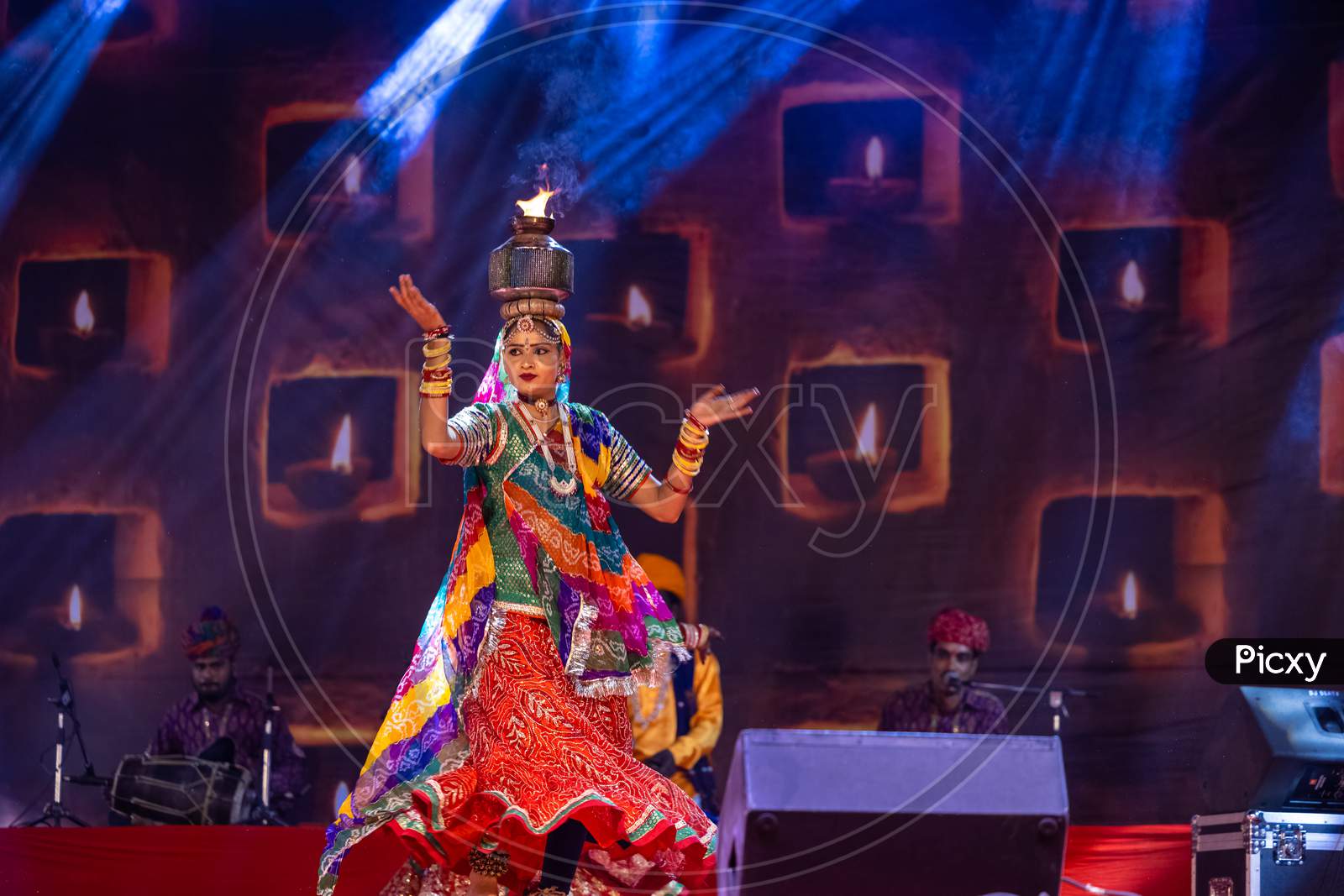 Female artist performing rajasthani folk dance ghoomar